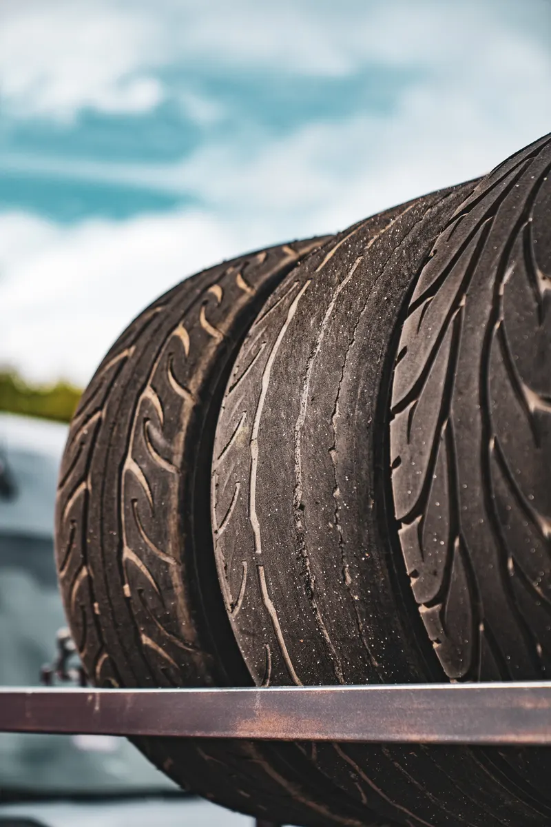 Worn tyres on a rack